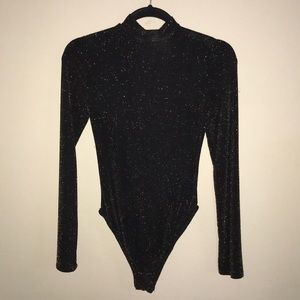 Black/gold sparkly turtle neck bodysuit